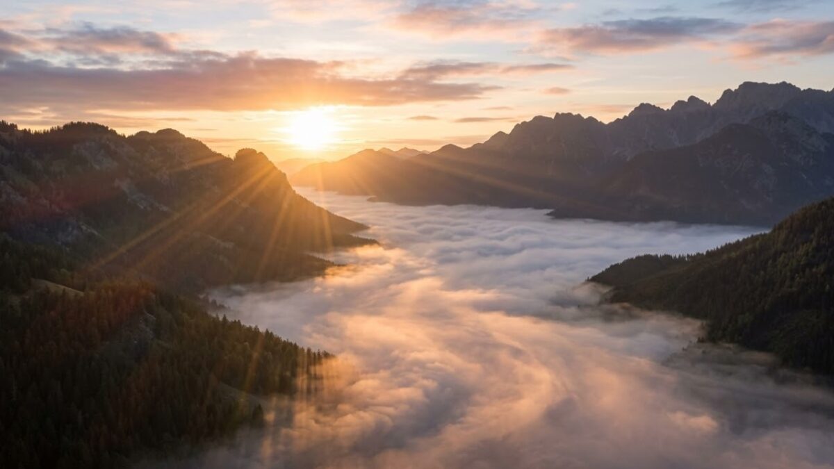 Sunrise over mountains above clouds, cremation services in Gilbert, AZ