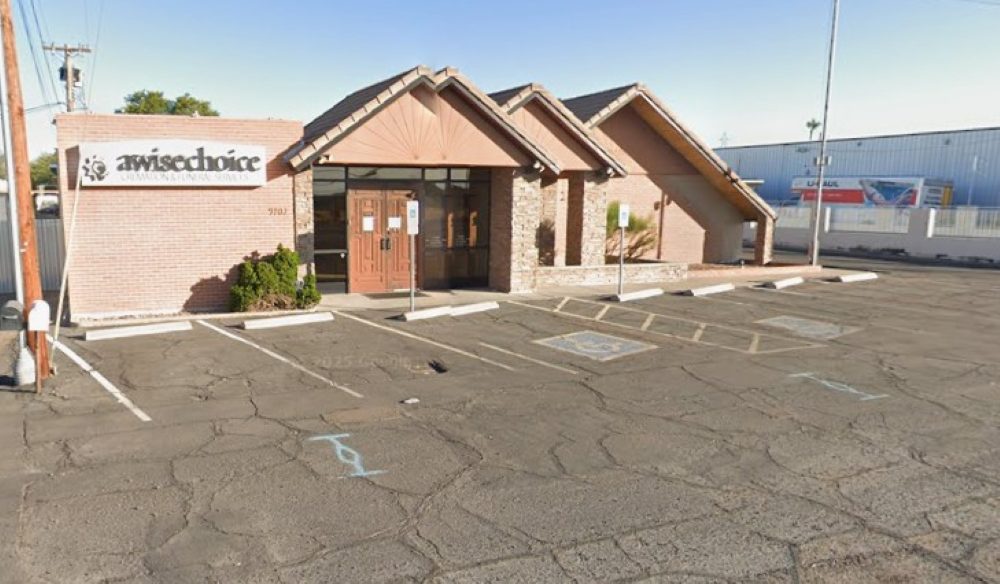 Direct Cremations Apache Junction, AZ awisechoice building exterior with brick facade, entry doors and parking.